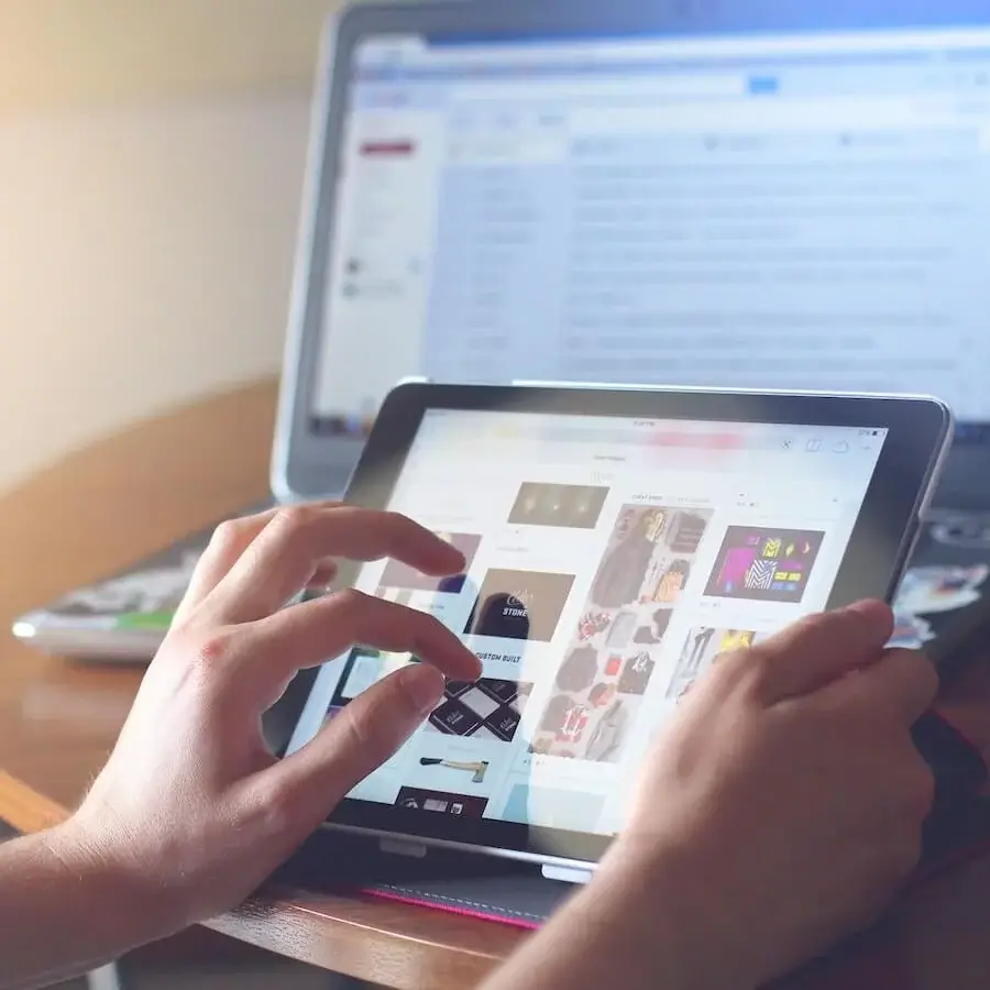 Someone zooming in on a tablet showing a web shop