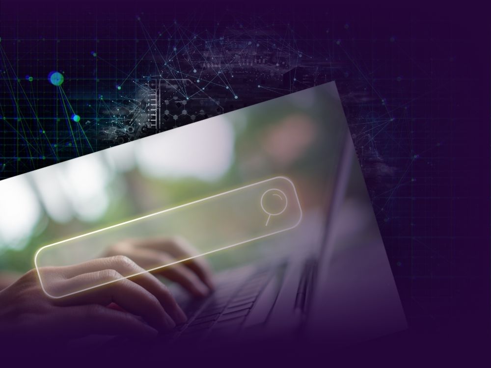 Close-up of hands typing on a laptop with a glowing search bar overlay. The background blends into a dark purple grid with digital nodes and abstract network connections, suggesting a high-tech or data-driven search interface.