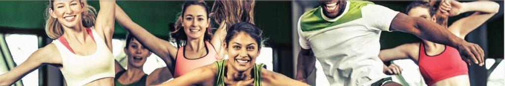 Several people doing sports in a fitness studio